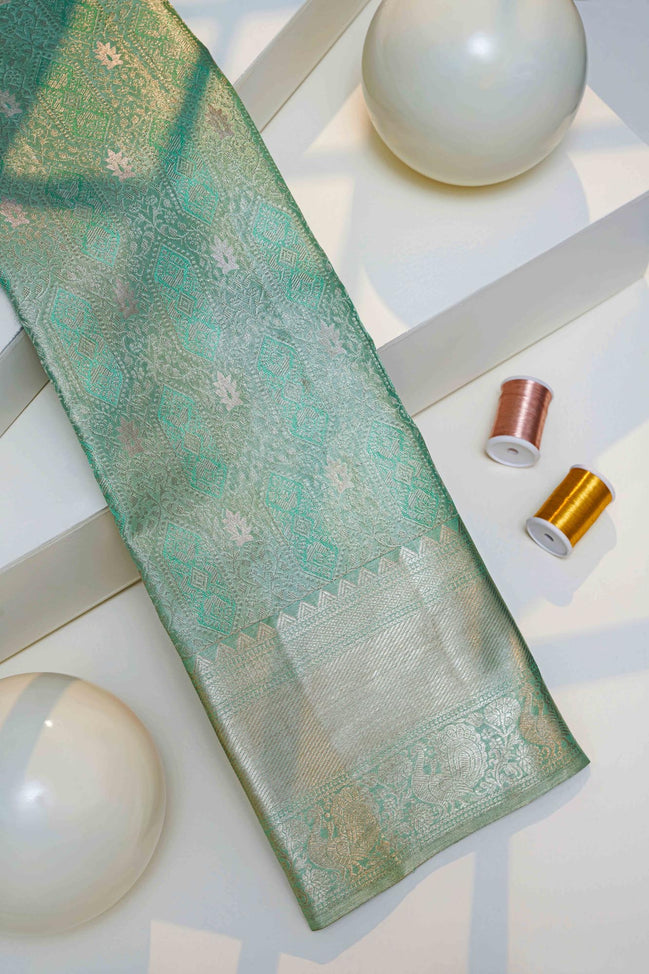 Geometric Diamond Ikat & Peacock Arch Border Sea-Green Pure Tissue Silk Saree