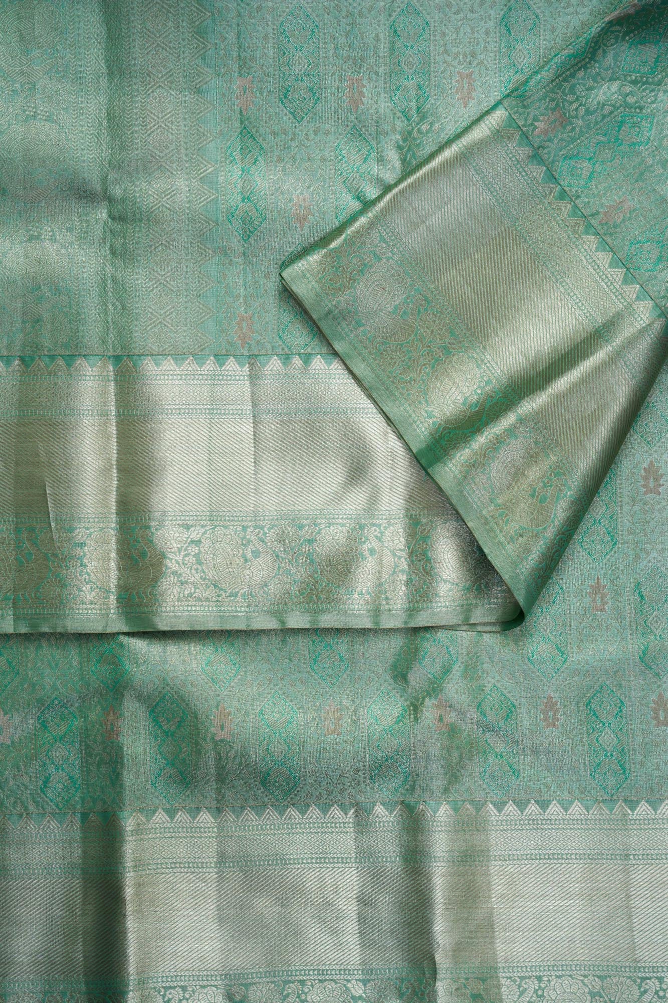Geometric Diamond Ikat & Peacock Arch Border Sea-Green Pure Tissue Silk Saree